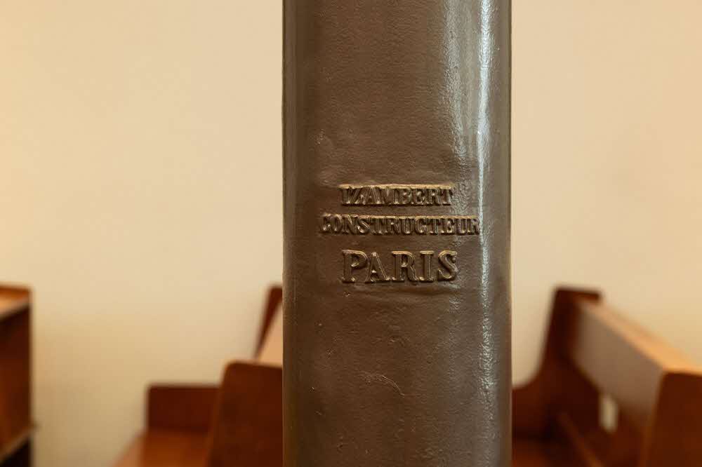 Iron beam in the Church of Our Lady of Lourdes bearing the mark of Izambert Constructeur, Paris.